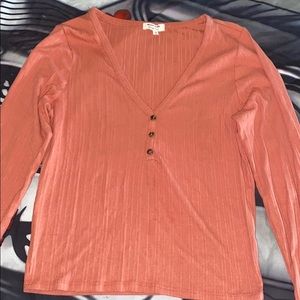 A nice peach color looking blouse.
